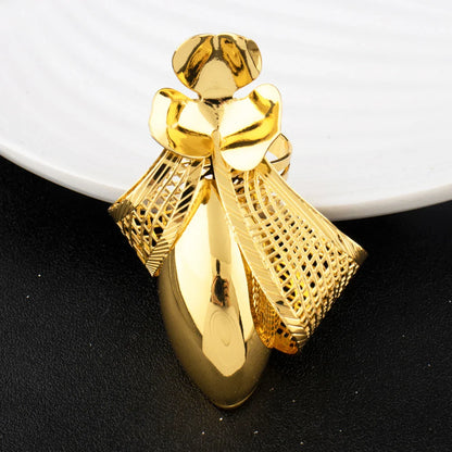 Luxury gold plated bow tie necklace elegantly displayed on a velvet background, emphasizing its sophisticated style.