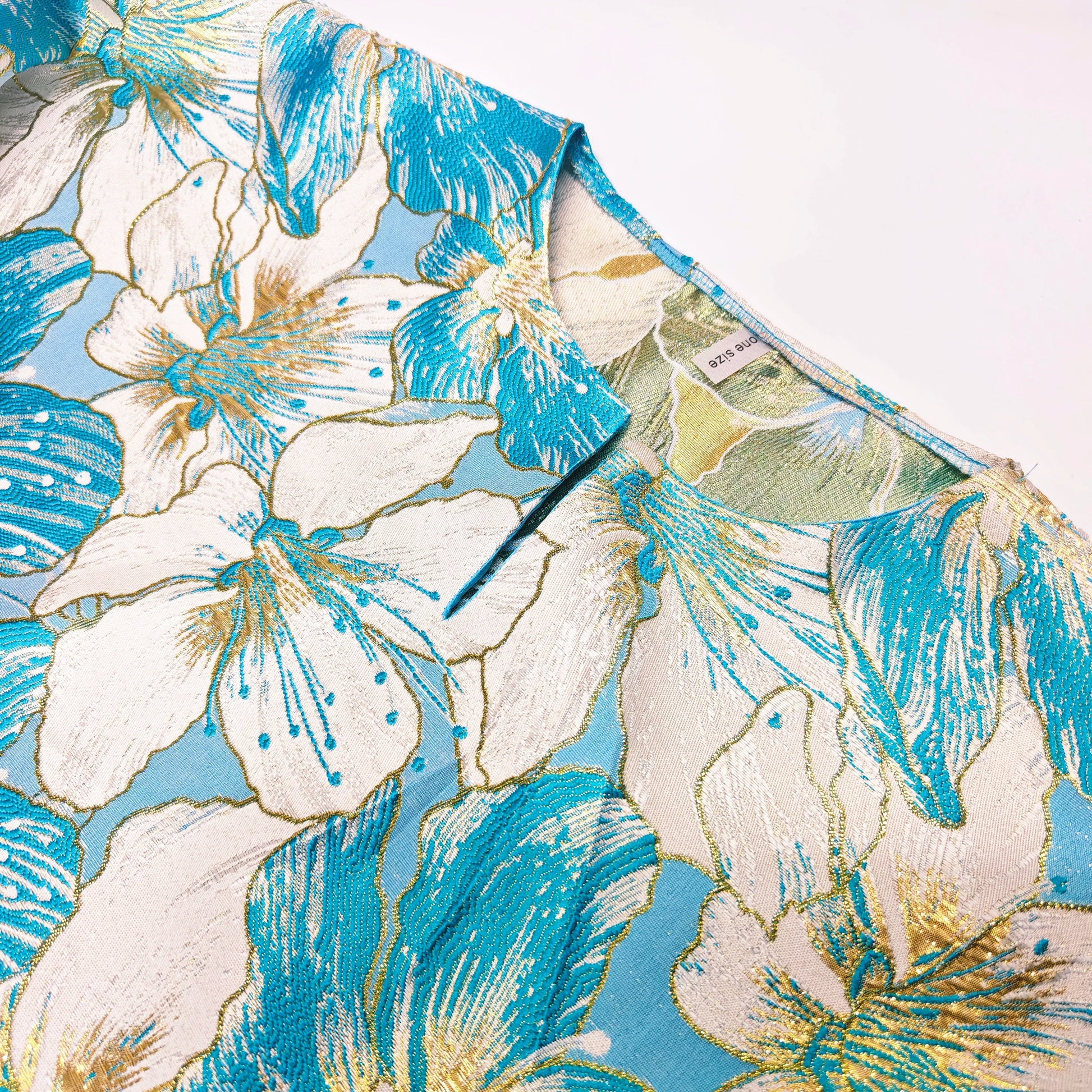 Luxury African Boubou Dress featuring vibrant brocade fabric and elegant Bazin Riche decoration for women at parties.