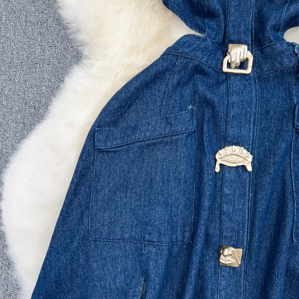 Chic close-up of women's denim dress illustrating mid-calf length and classic A-line silhouette, perfect for casual or formal occasions.