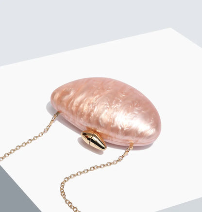 Chic ellipse clutch purse with chain, crafted from high-quality acrylic, showcasing sophistication for evening events.