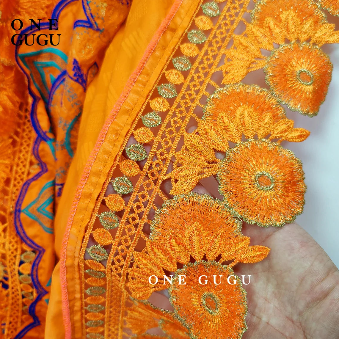 Chic orange Dashiki robe with luxurious embroidery lace, ideal for cultural celebrations and formal events.