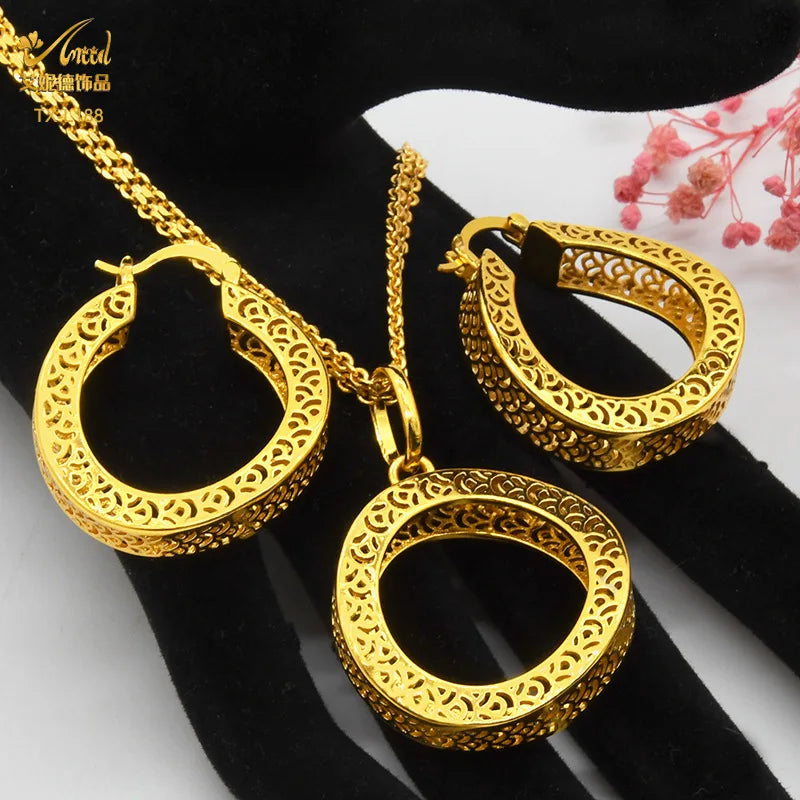 Exquisite 24K gold-plated copper necklace and earring set featuring enchanting geometric designs, perfect for enhancing elegance.