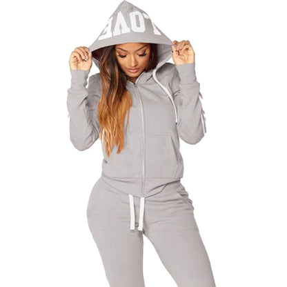 Chic and comfortable women's tracksuit, featuring a hood and regular fit, designed for the sophisticated sportswear enthusiast.