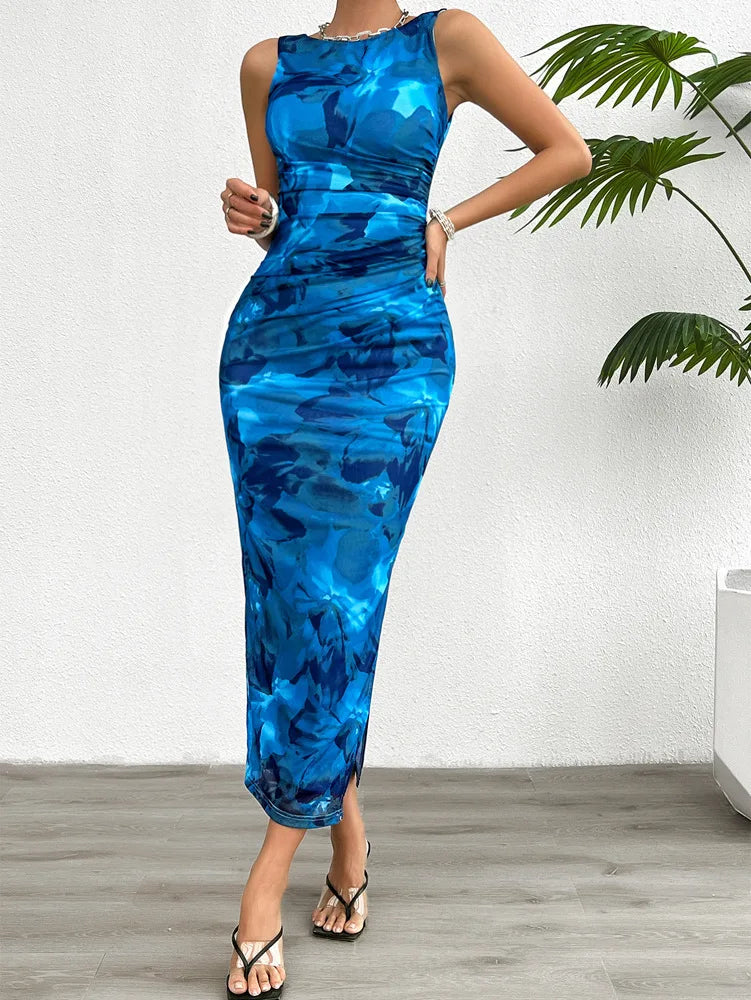 Chic sleeveless printed gown with a sophisticated split detail, embodying casual luxury for the spring and summer wardrobes.