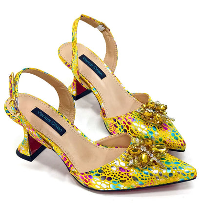 View of the luxurious yellow crystal design detailed on the pointed toe pumps, showcasing the sparkling finish ideal for special occasions.