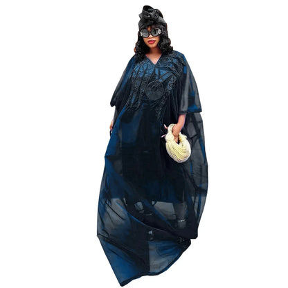 Refined plus size African dress with detailed embroidery, showcasing a sophisticated design ideal for special occasions.