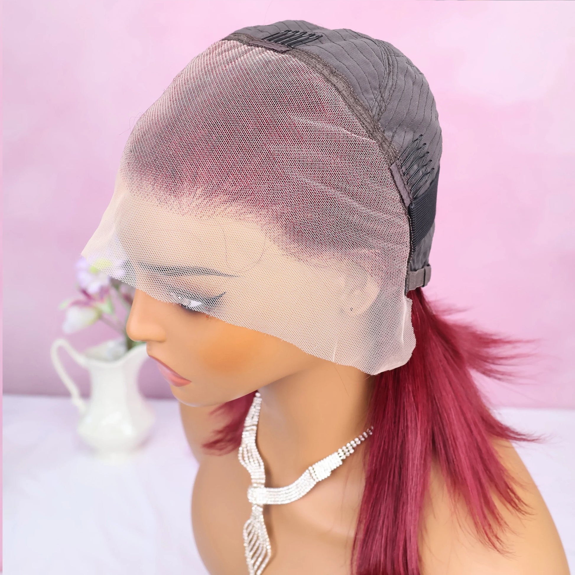 Display of the exquisite straight texture of the 99J Burgundy human hair wig, reflecting natural shine and sophistication.