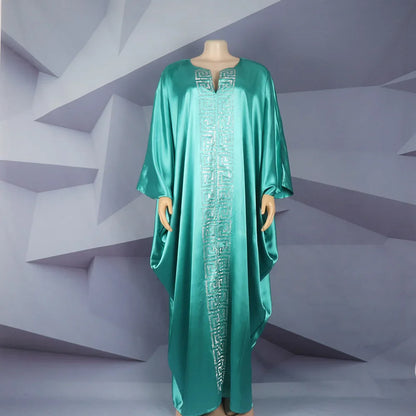 Plus size African abaya featuring a flowing long skirt and bat sleeves, designed for comfort and sophistication in spring and summer.