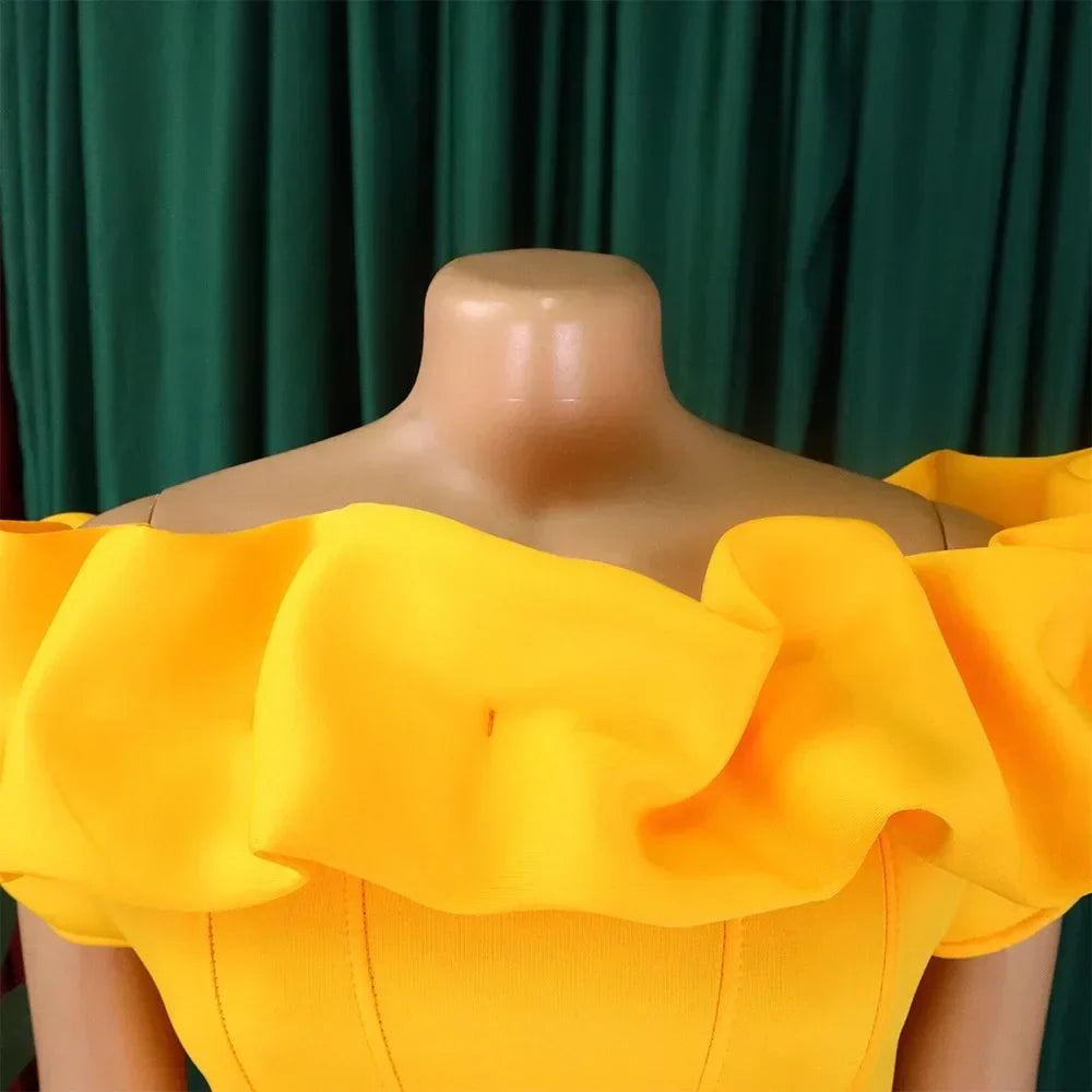 Close-up of the luxurious fabric of the elegant off-shoulder mermaid dress, showcasing ruffle details and floor-length design for a glamorous evening look.