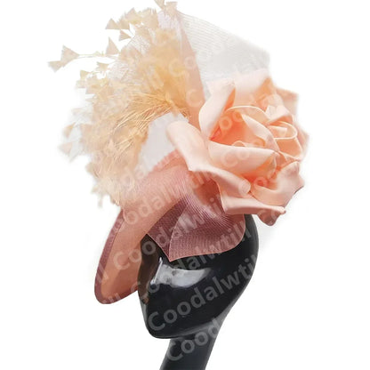 Fashionable purple pillbox hat with floral embellishments, ideal for women attending weddings and upscale tea parties, highlighting refined taste.