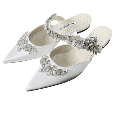 Luxury low heel mules sandals for women, combining comfort and style, with a silk upper and stunning crystal details for a glamorous summer look.