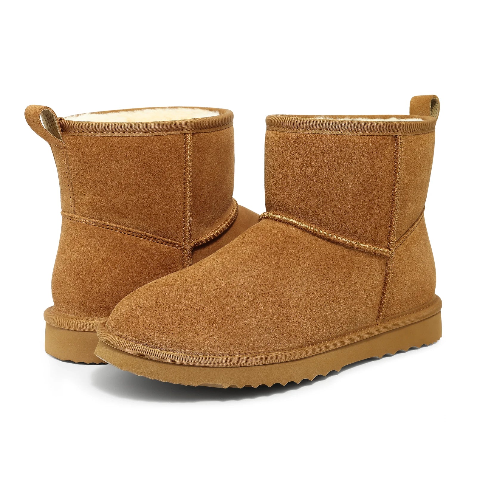 Luxurious women's ankle snow boots in plush suede, designed for warmth and ease, perfect for fashionable winter looks.