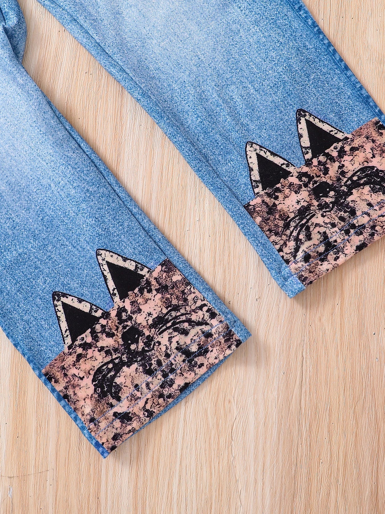 Stylish denim trousers perfectly paired with a cute cartoon top, designed for girls aged 4-6 years.