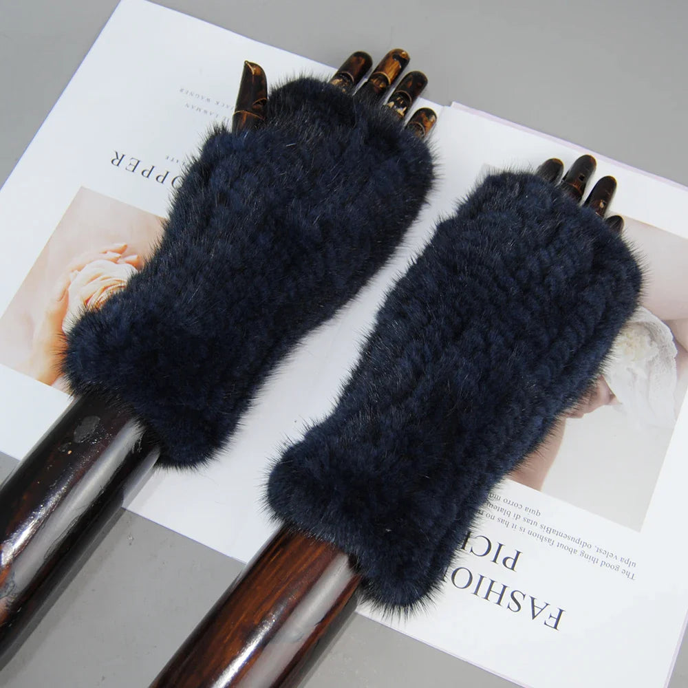 Fashionable women's half finger gloves in soft mink fur, perfect for keeping hands warm while typing elegantly.