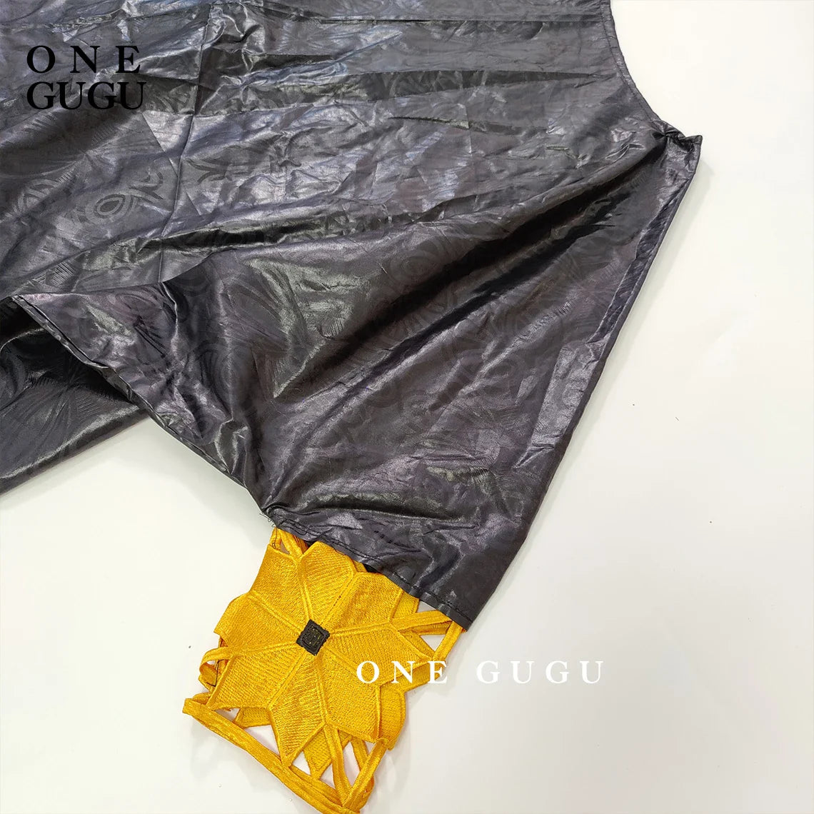 Luxurious gold and white African Bazin dress robe for women featuring elegant long sleeves and exquisite embroidery, perfect for special occasions.