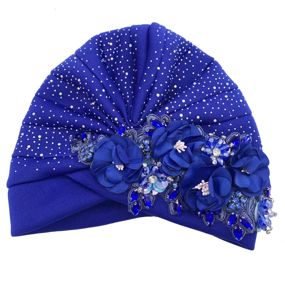 Versatile African turban cap, highlighting its trendy rhinestone embellishments and luxurious appeal, tailored for discerning women's fashion.