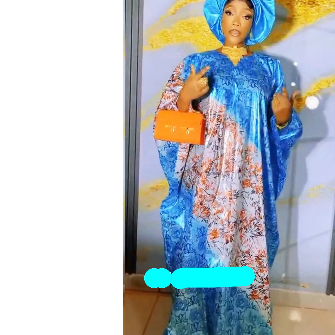 Stylish blue African Dashiki Bubu Dress shown elegantly draped, perfect for formal events, showcasing its sophisticated design and luxurious texture.