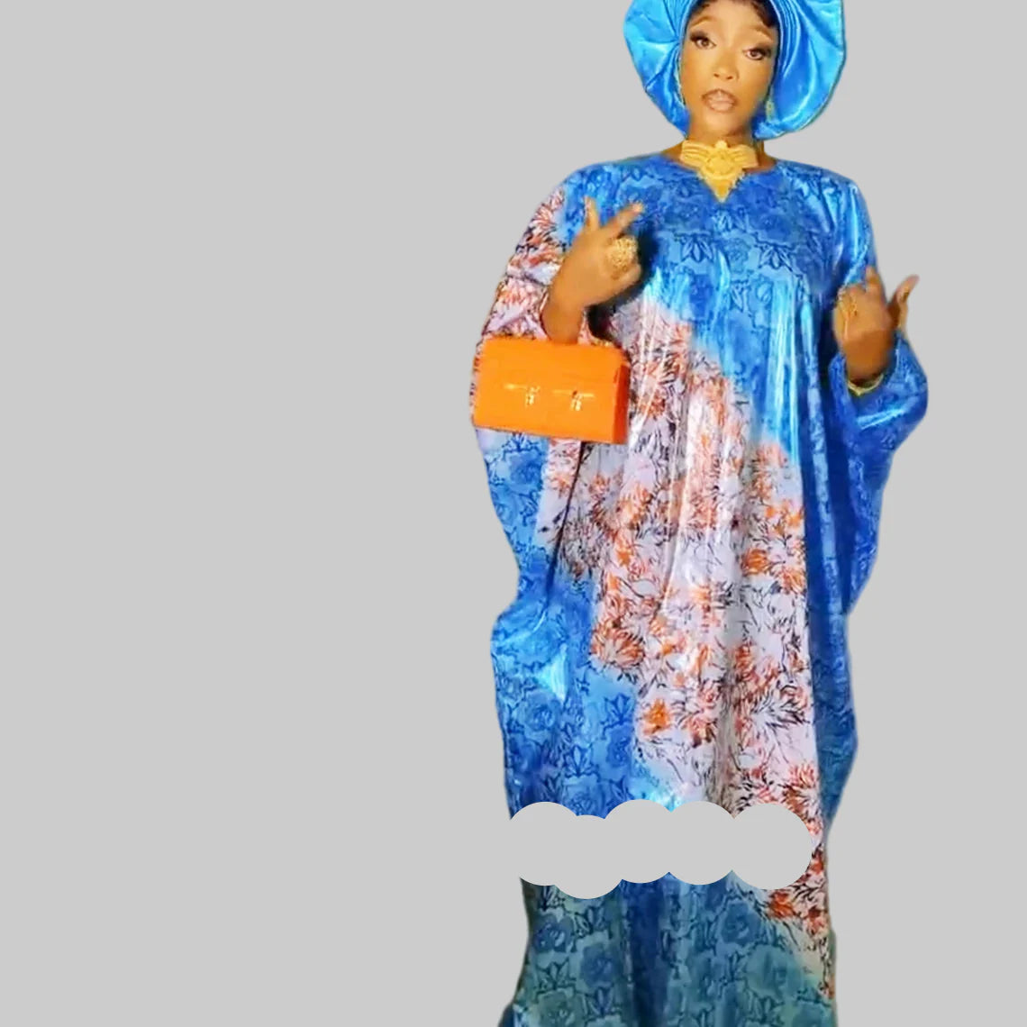 Detailed view of the embroidery lace and stones embellishing the luxurious Dashiki Boubou gown, showcasing exquisite craftsmanship and artistry.