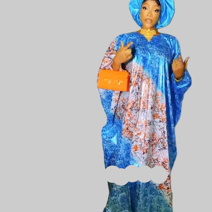 Detailed view of the embroidery lace and stones embellishing the luxurious Dashiki Boubou gown, showcasing exquisite craftsmanship and artistry.