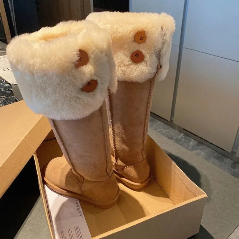 Elegant women's winter snow boots featuring plush fur upper and durable rubber soles, designed for warmth and style in mid-calf length.