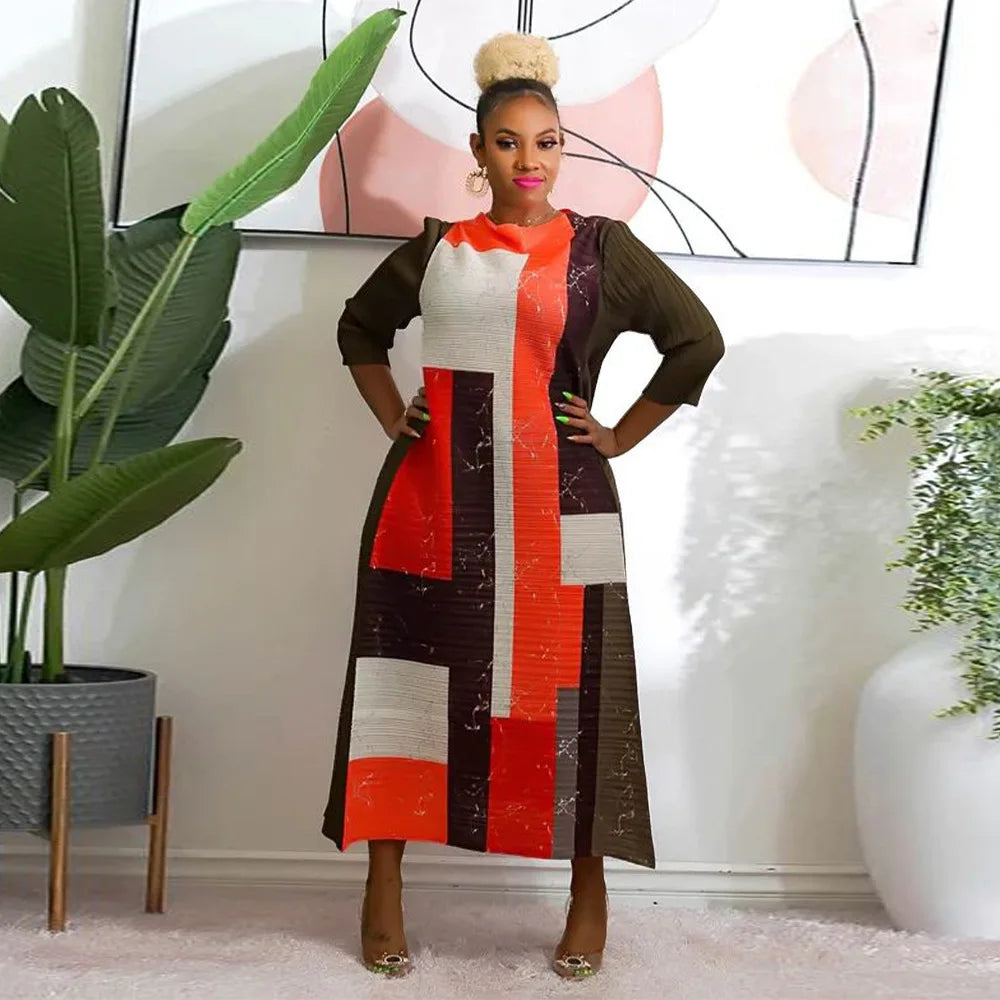 Sophisticated plus size women’s dress with a graceful O-neck and 3/4 sleeves, beautifully pleated for a luxurious appearance, available in rich, vibrant colors.