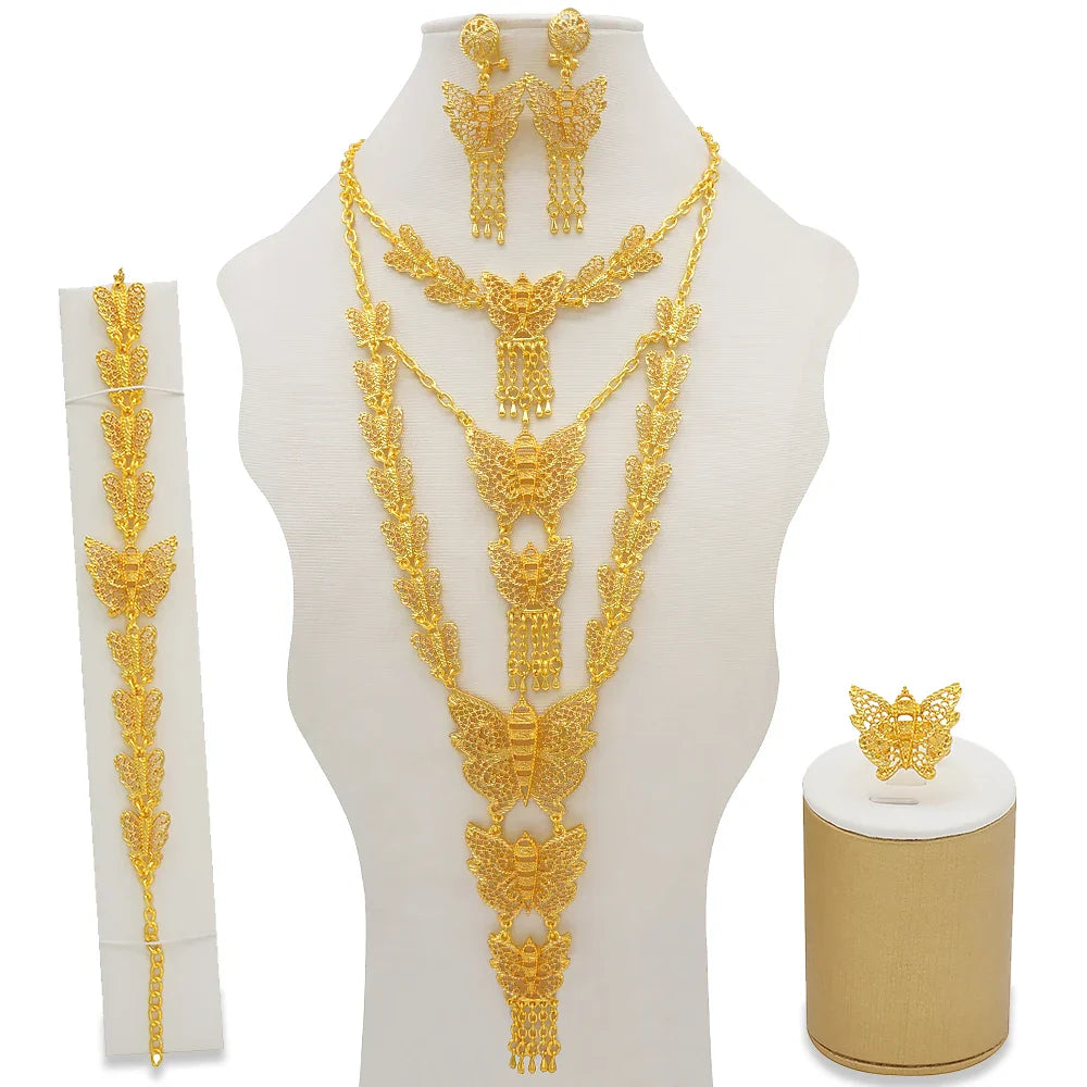 Fashionable gold colour jewelry set for women inspired by African elegance, includes a detailed necklace, beautiful earrings, matching bracelet, and a chic ring for special events.