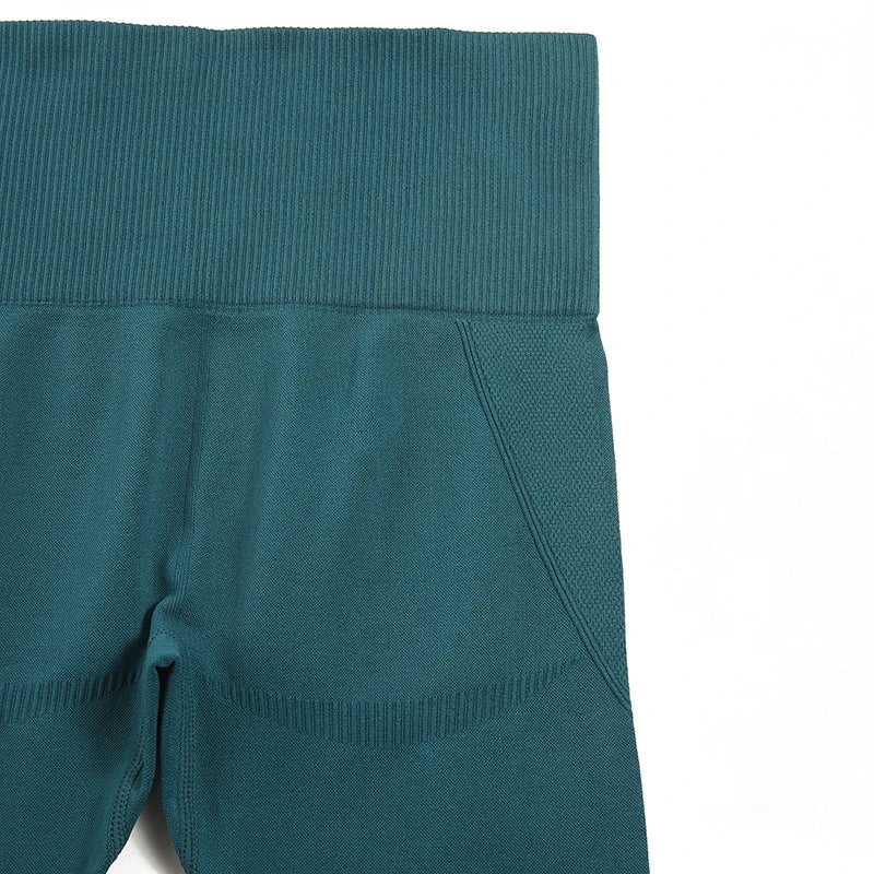 Elegant WAREBALL Seamless Yoga Set for Women in luxurious green fabric, featuring a stylish sports bra and fitted leggings, ideal for yoga and fitness.