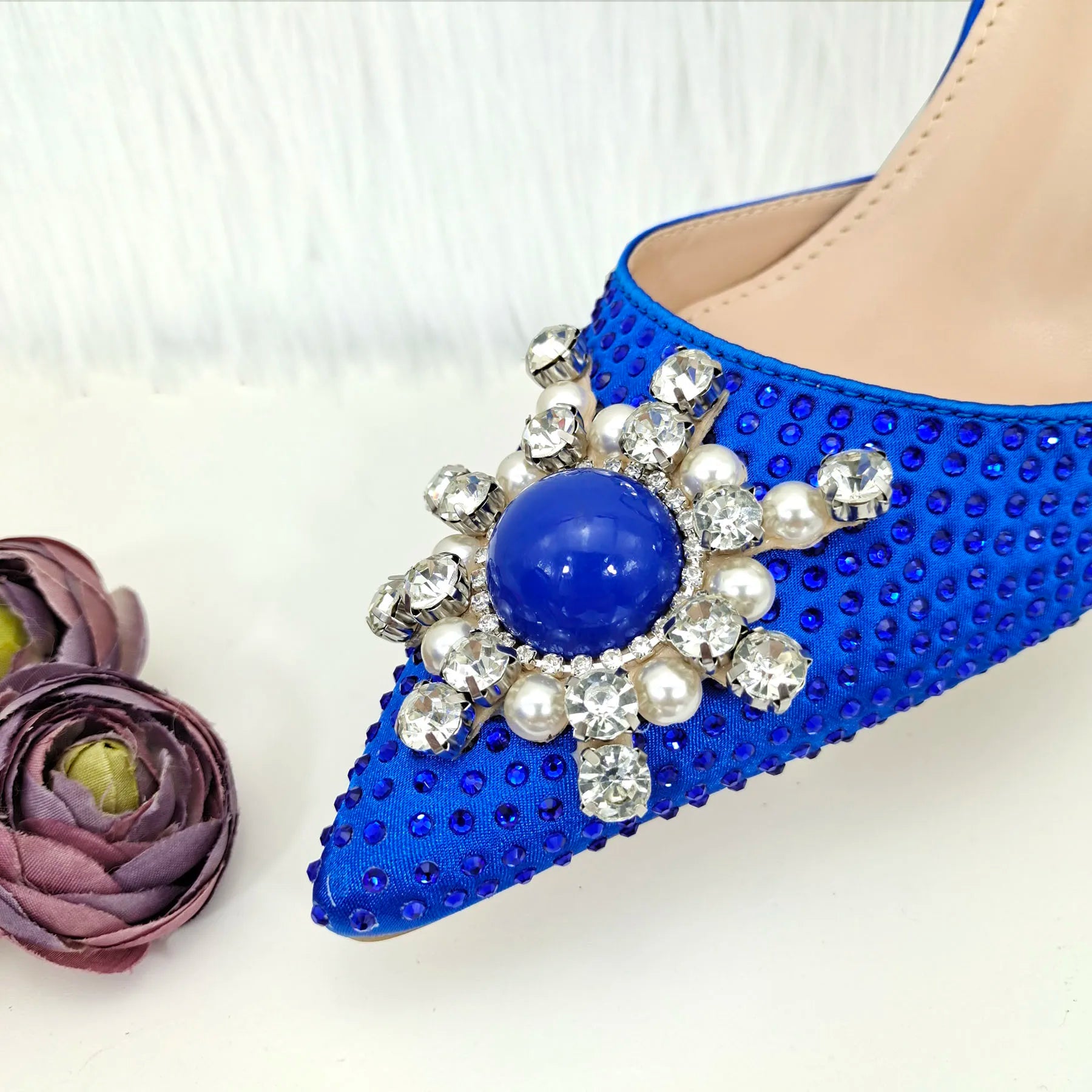Sophisticated blue stiletto heels sandals for women with intricate rhinestones and pearls, a fashion-forward choice for special occasions.