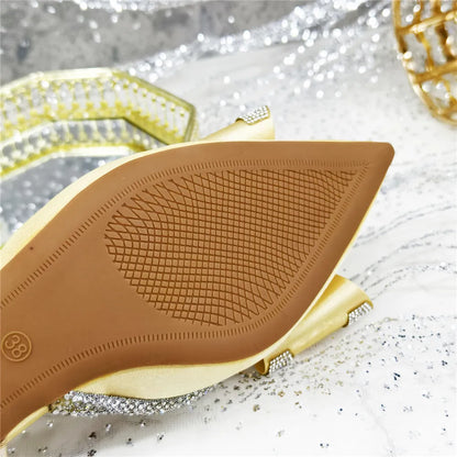 Close-up view of women's elegant party sandals showcasing shimmering crystal chain embellishments on a stylish peep toe pump.