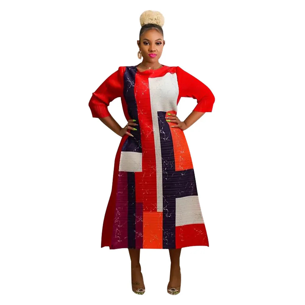 Captivating African plus size dress, featuring a flowing silhouette, unique pleats, and a bold colour palette, exemplifying traditional elegance for modern women.