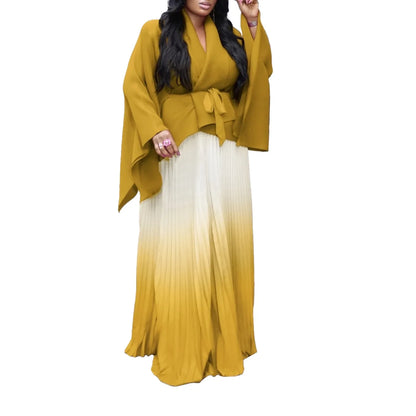 Sophisticated two-piece set from CM.YAYA featuring a full sleeve blouse and a floor-length skirt, ideal for high street fashion.