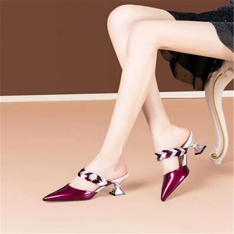 Stylish open-toe slippers crafted from luxurious fur, presenting a geometric pattern for a fashionable touch, designed for comfort and elegance.