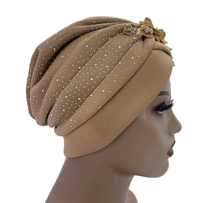 Versatile African turban cap, ideal for all seasons, illustrating the elegant silhouette and standout rhinestone features.