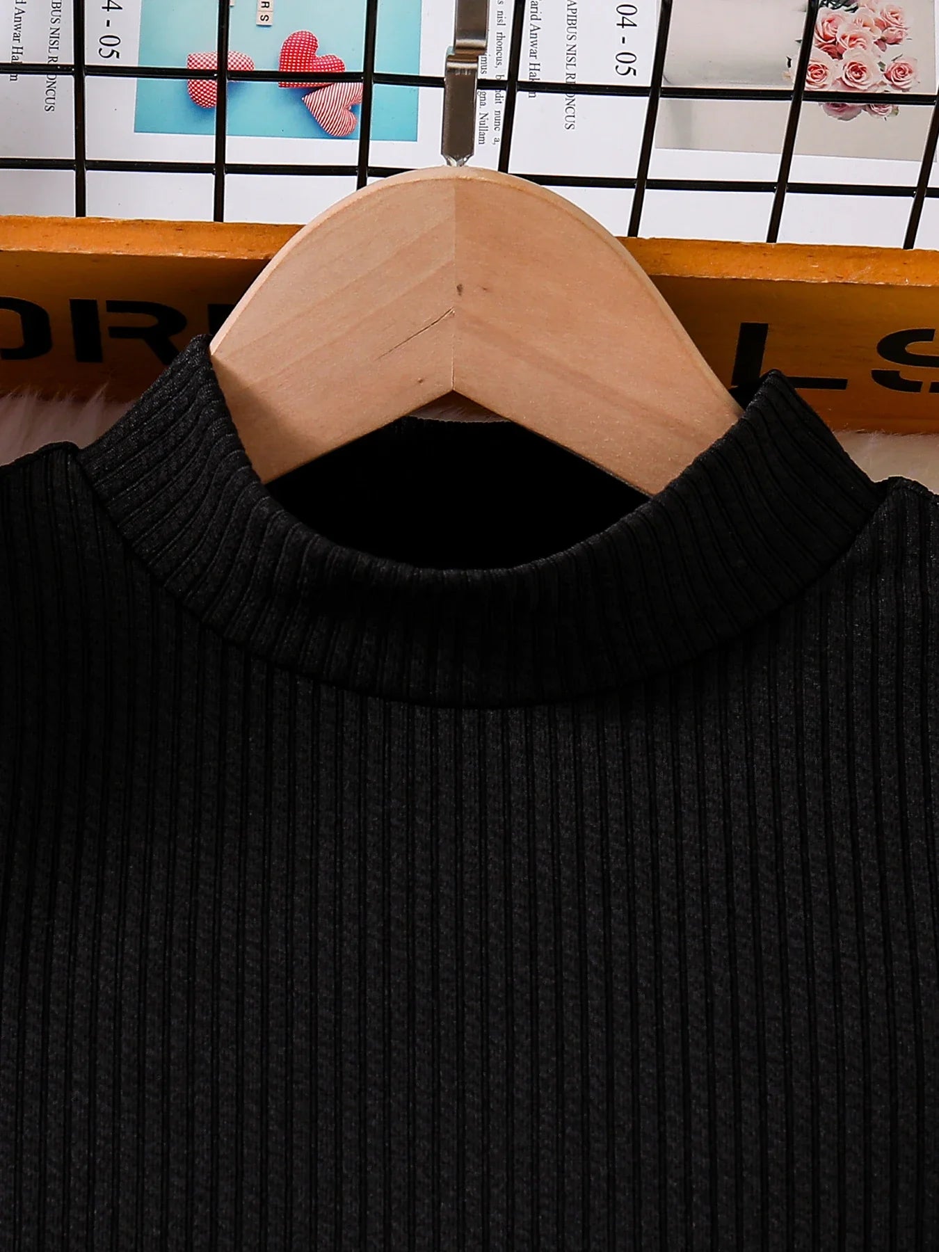 Close-up of the sumptuous knit texture of the girls' casual top, showcasing its high-quality craftsmanship for ages 4-6Y.