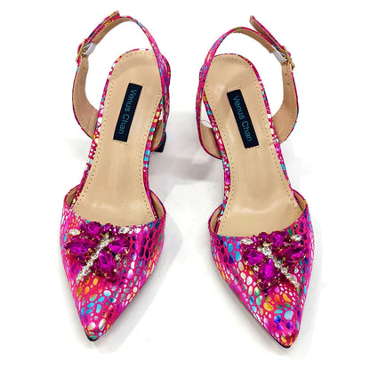 Luxury women's pointed toe pumps and matching bag set displayed elegance and upscale fashion.