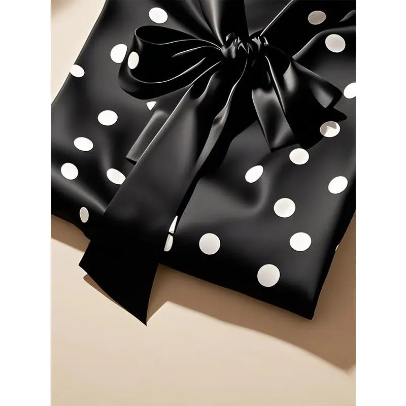 Elegant long sleeve blouse for women in satin with a sophisticated polka dot pattern, ideal for chic office attire.