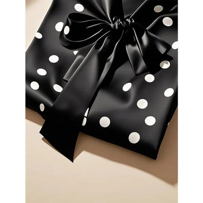 Elegant long sleeve blouse for women in satin with a sophisticated polka dot pattern, ideal for chic office attire.