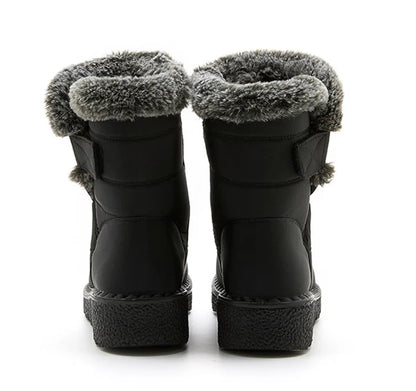 Fashion-forward luxury women's ankle boots with fur, beautifully arranged on a winter-themed backdrop, showcasing their stylish design and practicality.