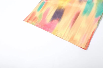 Close-up view of the sleek and sophisticated sleeveless BWQ maxi dress showcasing its intricate tie-dye design, ideal for chic autumn outings.