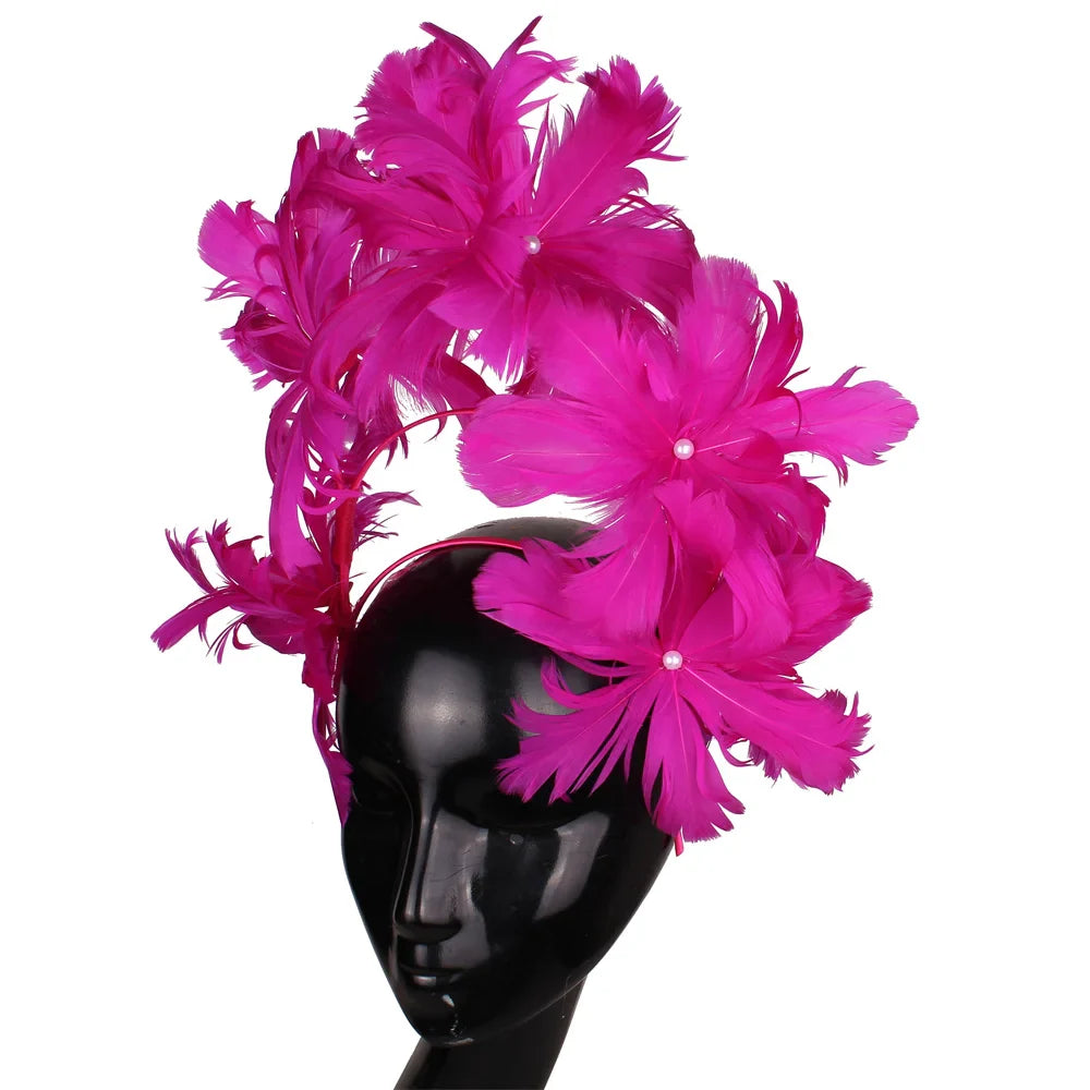 Delicate close-up of an elegant blue feather fascinator, perfect for weddings and special occasions, highlighting its intricate design and stylish appeal.