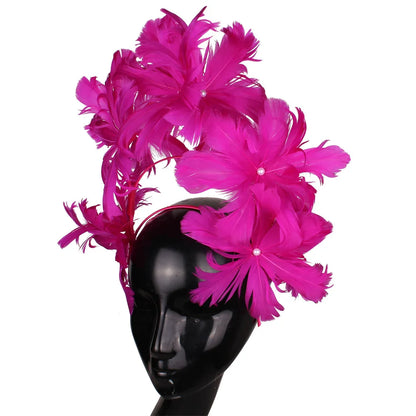 Delicate close-up of an elegant blue feather fascinator, perfect for weddings and special occasions, highlighting its intricate design and stylish appeal.