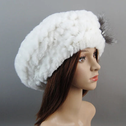 Luxurious women's winter faux fur hat and scarf set, featuring an elegant knit design, perfect for cold weather.