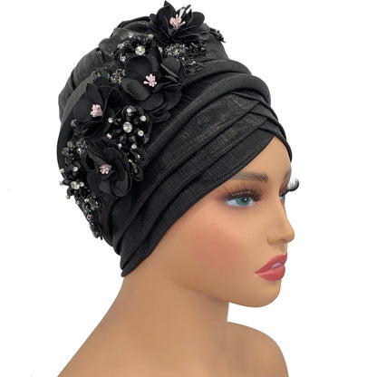 Luxurious African women's turban cap adorned with a sparkling diamond flower, showcasing elegant design for sophisticated style.