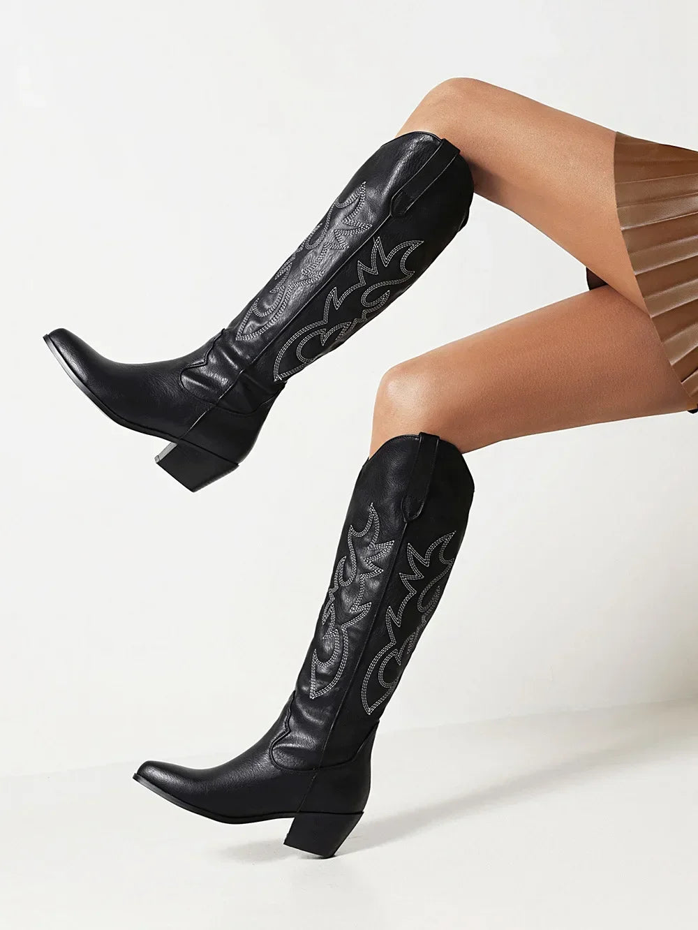 Fashion-forward women's knight boots in rich brown PU leather, featuring a sleek pointed toe and platform for enhanced style.