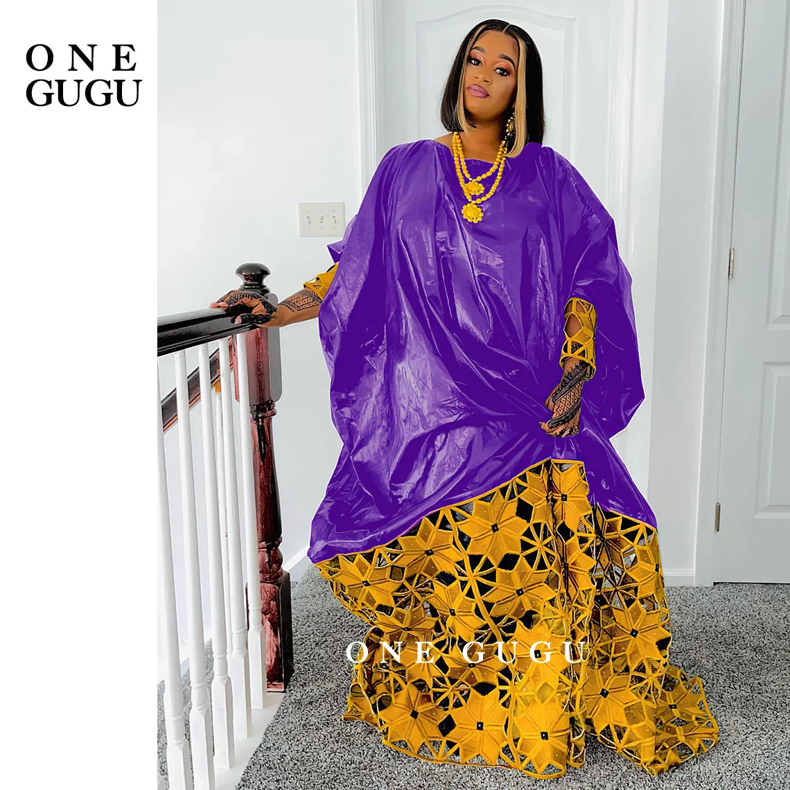 Elegant gold and white African Bazin dress robe for women, showcasing luxurious long sleeves and intricate embroidery lace detailing.