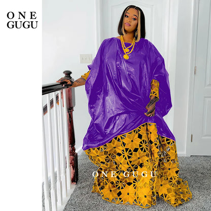 Elegant gold and white African Bazin dress robe for women, showcasing luxurious long sleeves and intricate embroidery lace detailing.