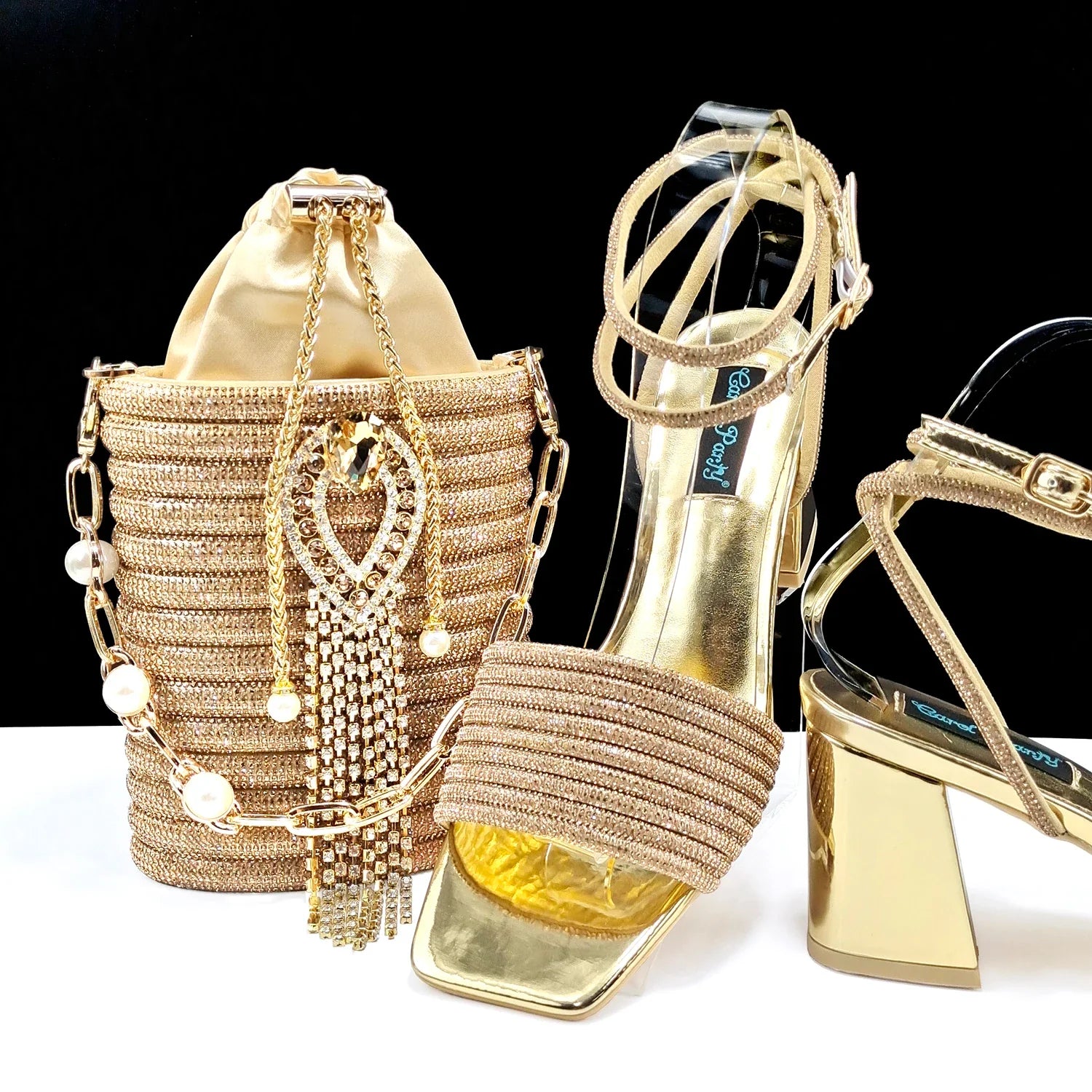 Elegant handbag perfectly matching olive green high heel peep toe pumps, ideal for stylish women on special occasions.