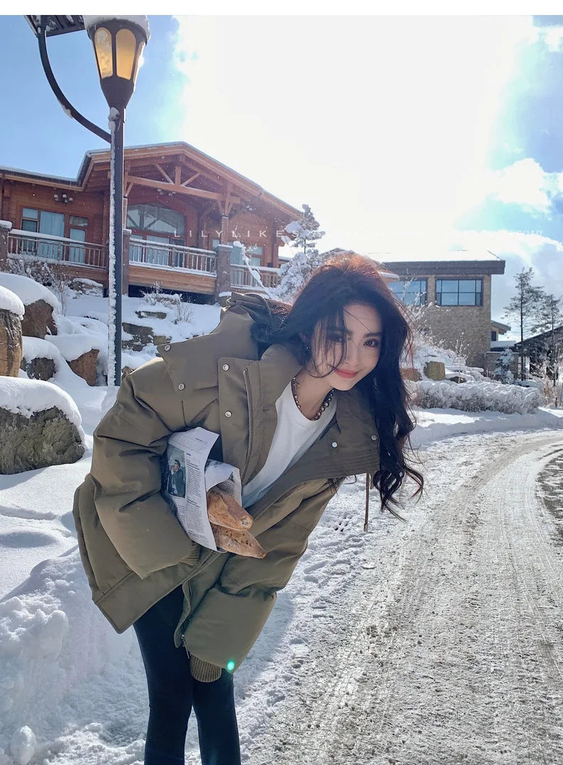 Luxury women's thick warm hooded down cotton jacket in elegant black, perfect for winter comfort with practical pockets.