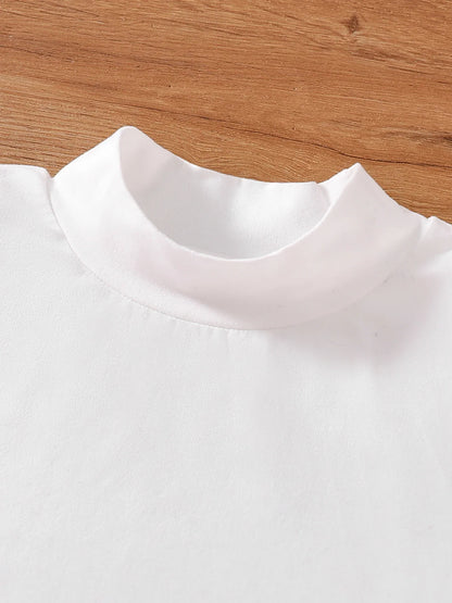 Luxurious pink checkered coat designed for girls aged 7-13, showcasing autumn fashion trends in a stylish ensemble.