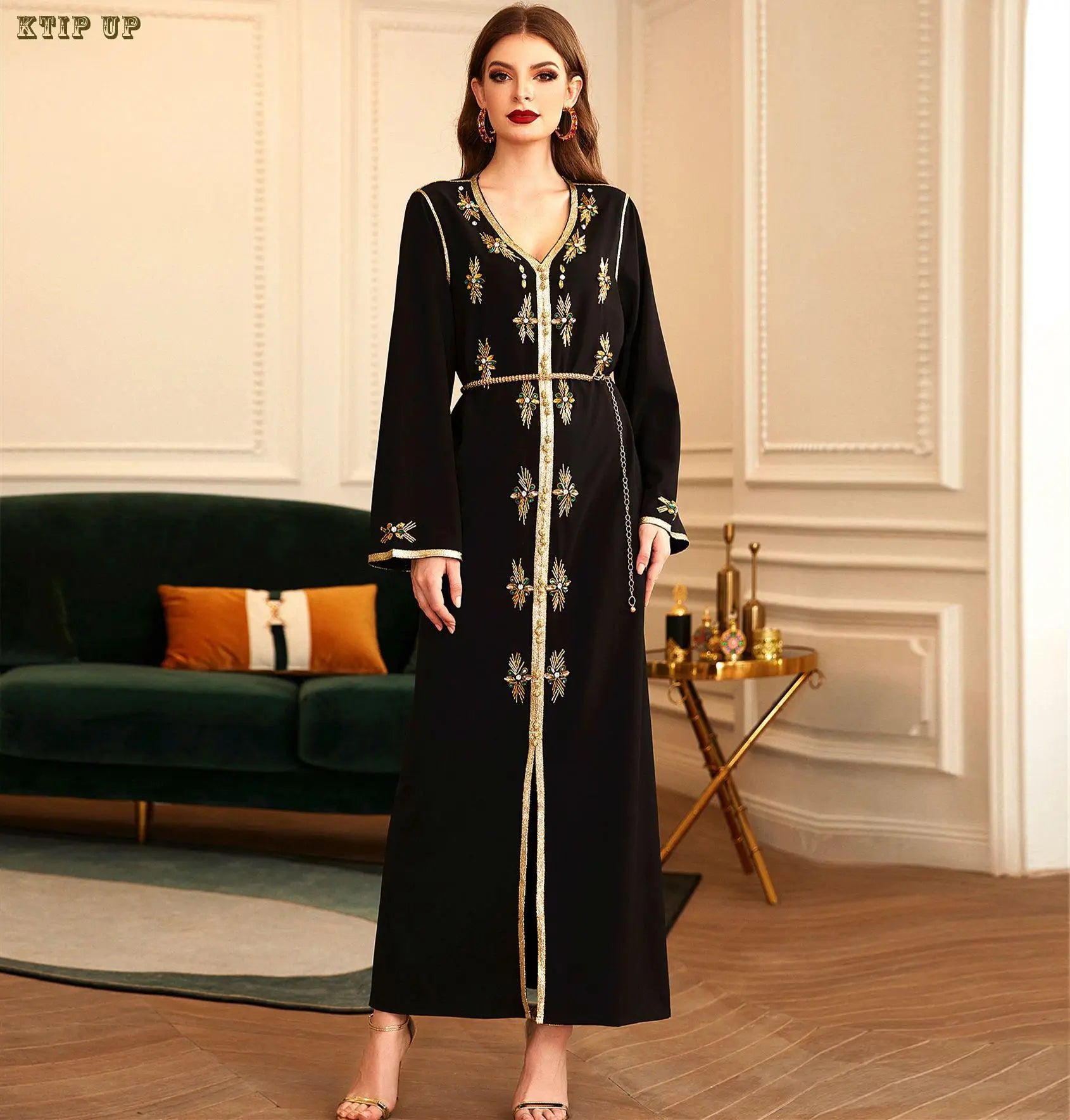 Close-up of sequined details on a golden velvet Moroccan Dubai dress, showcasing intricate craftsmanship and luxury.